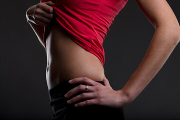 Fototapeta premium Diet, exercise yield woman's flat belly