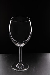 photo glass of wine on a black background