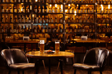 interior of evening pub. beer on the table in the evening bar. table with beer glasses
