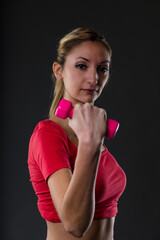 Fitness woman, pink weight, blurry