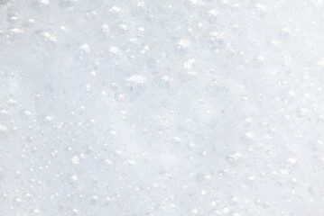 Soap bubbles.Abstract background white soapy foam texture.Shampoo foam with bubbles.Indoors shot.