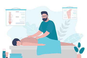 Relaxed woman getting back massage in spa with professional massage therapist. Wellness, healing and relaxation concept. Young adult lying and male masseur massaging her body.