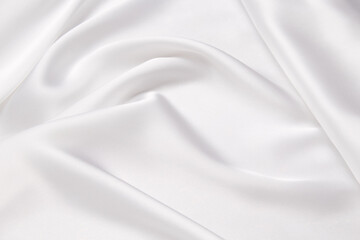 Abstract white fabric texture background. Cloth soft wave. Creases of satin, silk, and cotton.