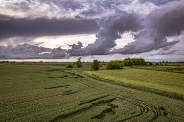 Stormy Clouds Over Lush Fields in Northern Italy