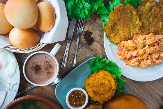 Various delicious Latin American dishes with coffee and juices served on table