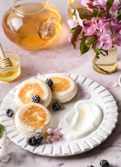 cottage cheese pancakes with honey and sour cream