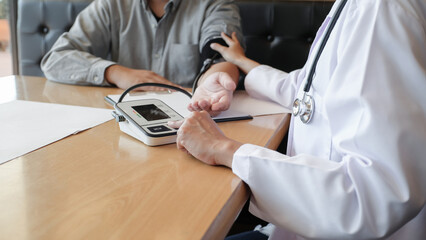 Doctor checking  patient arterial blood pressure. Health care