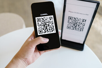 Qr code payment. E wallet. Man scanning tag accepted generate digital pay without money.scanning QR code online shopping cashless payment and verification technology concept.