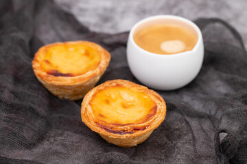 Egg tart, traditional Portuguese dessert, pastel de nata and coffee