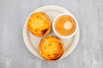 Egg tart, traditional Portuguese dessert, pastel de nata and coffee