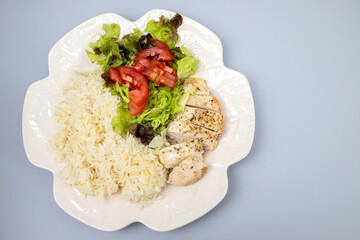 Diet food. Chicken breast with boiled rice and salad. Healthy lifestyle. Sports nutrition.