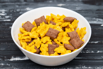 Corn and chocolate breakfast cereal in bowl