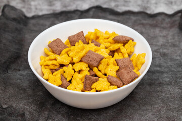 Corn and chocolate breakfast cereal in bowl