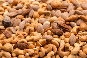 A group of almonds, pistachios, walnuts, macadamia, cashews.