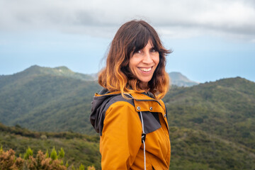 Woman smiling after finishing trekking on top of Garajonay in La Gomera, Canary Islands