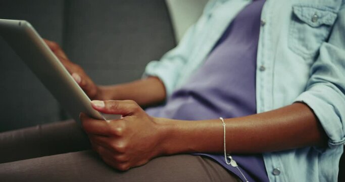 Hands, tablet and a woman typing for communication on home sofa with internet connection. Closeup of a female person with tech in hand for social media, research and streaming or online shopping