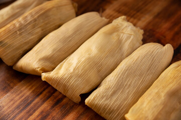 Tamales. Prehispanic dish typical of Mexico and some Latin American countries. Corn dough wrapped in corn leaves. The tamales are steamed.