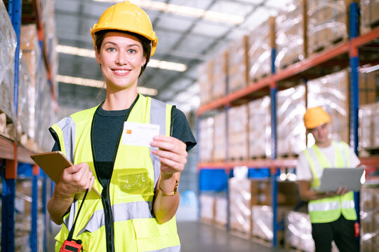 African-American woman foreman with positive thinking and carry credit cards for convenience at wholesale warehouse stores. self service concept