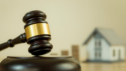 Fair hammer, hammer and wooden house The concept is used in real estate law agreements.