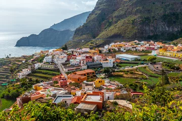 Fotobehang Canarische Eilanden View of the town of Agulo between the valleys and municipalities of Hermigua and Vallehermoso in La Gomera, Canary Islands