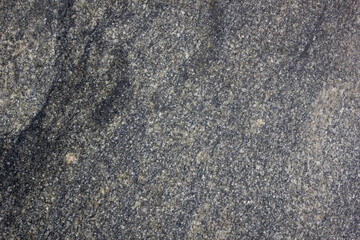 Granite wall.Texture of dark natural granite stone. Authentic granite background.