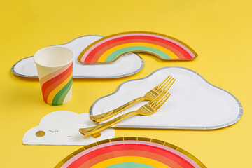 Cute paper party plates in the shape of rainbow and clouds with cups for themed kids party....