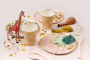 Safari animals birthday party decorations and props. Cute paper party plates and cups for themed kids party. Set of holiday disposable tableware for party or picnic.