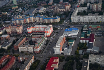 View from the plane when landing on an industrial city