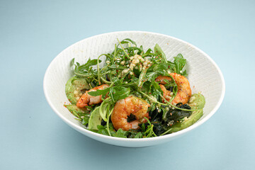 Portion of healthy gourmet shrimp salad with avocado