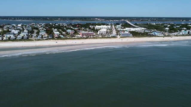 Drone shot flying in towards Vilano beach Florida from out over the water 