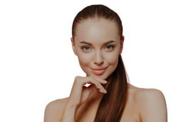 Skin care and anti aging procedures. Confident brunette young woman keeps hand under chin, has combed hair, clean fresh skin, enjoys beauty treatments, poses with naked body over pink background
