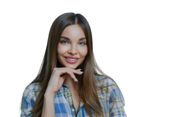 Close up portrait of cute friendly looking lady touches chin, has healthy skin, minimal make up, looks with warm tender expression, has well cared hair poses against blue background. Beauty, skin care