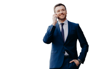 Optimistic male owner of buisness company dressed in elegant suit, has telephone conversation, consults with operator, looks into distance, has happy look, stands outside. People and communication