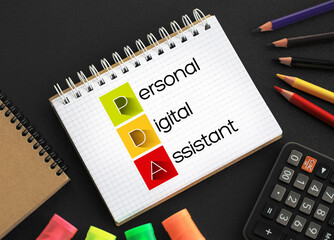 PDA - Personal Digital Assistant acronym on notepad, technology concept background