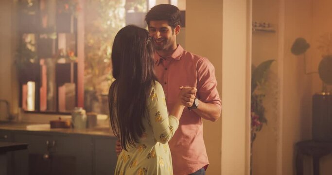 Young Couple Dancing in the Kitchen with Calm Passion. Moment of Love and Intimacy. Couple Slowly Waltzing. Looking into each Other Eyes tenderly. Happiest people in the world. Medium Slow Motion