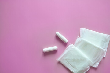 pads and tampons on a pink background, intimate hygiene, womens hygiene, menstruation and critical days, womens health, banner