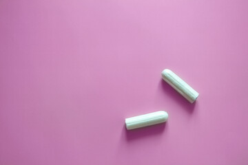 tampons on a pink background, intimate hygiene, womens hygiene, menstruation and critical days, womens health, banner
