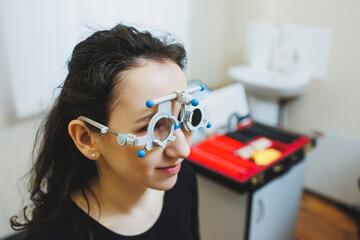 Eye examination of a young woman at an ophthalmologist's appointment using modern microscopes....