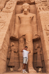 young male traveler visits Abu Simbel. Egypt. vertical composition