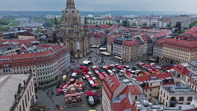 Drone shot of People on Market Place ( The Neumarkt ) on a Sunny Spring Day in Dresden , it is a central and culturally significant section of central Dresden, Germany . Busy Market Square .