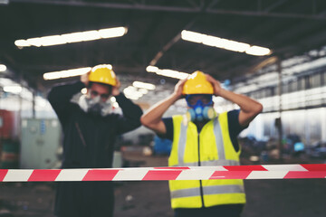 Group of chemical specialist wear safety uniform, gas mask making line symbol signal no entry chemical dangerous area in the industry factory while standing behind line area barrier red, white colour