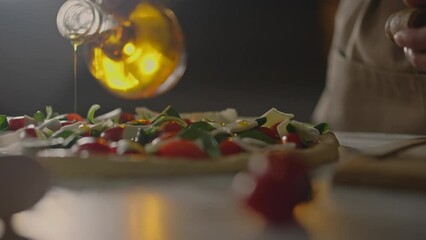 Italian pizzeria, Chef in action preparing pizza Responsibly Adds pouring vegetable olive oil at baker's workplace Woman baker Works at takeaway food center, bakery
