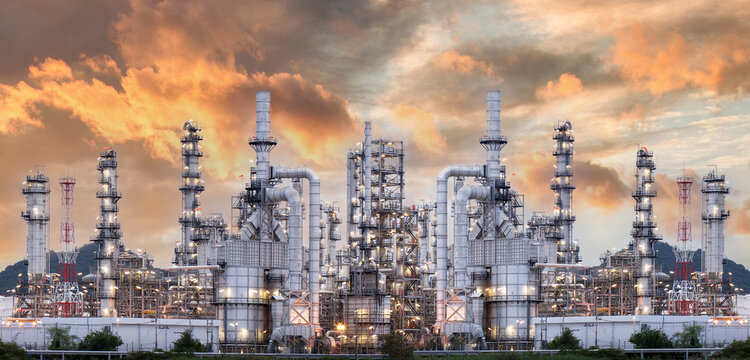 .Industrial oil refinery and petrochemical plants Refinery plants Natural gas storage tanks Petroleum industry Yellow sunrise background