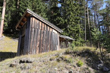 an old little crooked hut in the alps