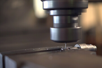 Close up shoot showing a drilling - lathing machine in operating.