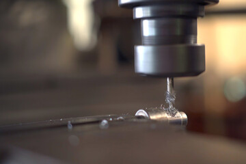 Close up shoot showing a drilling - lathing machine in operating.