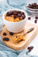 Baked Oatmeal with Dried Fruits like Sultanas, Raisins and Grapes, single portion meal made from oats