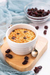 Baked Oatmeal with Dried Fruits like Sultanas, Raisins and Grapes, single portion meal made from oats