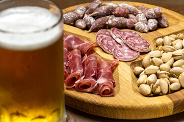 Sausages and pistachios and a glass of beer