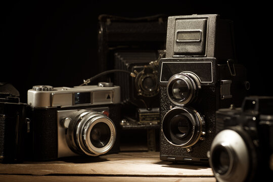 Close-up of a group of antique film cameras